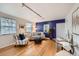 Inviting living room with ample natural light, hardwood floors, and comfortable seating area at 1279 Leyden St, Denver, CO 80220