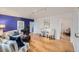 Stylishly furnished living room showcasing hardwood floors, a blue accent wall, and ample natural light at 1279 Leyden St, Denver, CO 80220