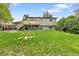 Spacious backyard with a lush lawn and a deck, ideal for entertaining and enjoying the outdoors at 16025 E Warren Pl, Aurora, CO 80013