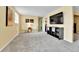 Finished basement with neutral paint, updated carpet, and television at 16025 E Warren Pl, Aurora, CO 80013