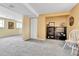 Finished basement with neutral paint, updated carpet, and decorative shelving at 16025 E Warren Pl, Aurora, CO 80013