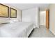 A spacious bedroom features carpeted flooring, closet, neutral walls, and ample natural light at 16025 E Warren Pl, Aurora, CO 80013