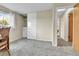 A spacious bedroom features carpeted flooring, neutral walls, and closet space at 16025 E Warren Pl, Aurora, CO 80013