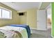 Bright bedroom with closet and large window, features a bed with blue and white comforter at 16025 E Warren Pl, Aurora, CO 80013