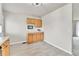 A well-lit breakfast nook features tile flooring, wood cabinets and ample counter space at 16025 E Warren Pl, Aurora, CO 80013