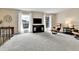 Bright living room with plush carpet, large windows, and comfortable seating at 16025 E Warren Pl, Aurora, CO 80013