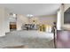 Open living room featuring dining room and stairs, and wall art at 16025 E Warren Pl, Aurora, CO 80013