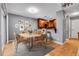 Open dining area with a modern table and chairs, adjacent to kitchen at 2903 W Long Cir # E, Littleton, CO 80120