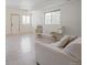 Well-lit living room with natural light and wooden floors, furnished with comfortable seating options at 18155 Flowered Meadow Ln, Monument, CO 80132