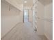 A bright walk-in closet with carpet floor and shelves, complete with rods for hanging clothes at 18155 Flowered Meadow Ln, Monument, CO 80132