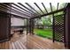 Relax on this beautiful back deck with a wood pergola, built-in seating, and view of the large back yard at 3565 W 112Th Cir, Westminster, CO 80031