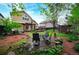Backyard with an outdoor table and chairs, deck with a pergola, and colorful landscaping at 3565 W 112Th Cir, Westminster, CO 80031