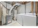 Unfinished utility room with a water heater, furnace, and a washer and dryer at 3565 W 112Th Cir, Westminster, CO 80031