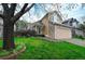 Charming two-story home features a stone and vinyl facade, well-manicured lawn, and an attached two-car garage at 3565 W 112Th Cir, Westminster, CO 80031