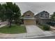 Inviting two-story home with stone accents, a well-manicured lawn, and a spacious two-car garage at 3565 W 112Th Cir, Westminster, CO 80031