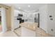 Clean kitchen with stainless appliances, white cabinets, and an island with natural wood countertop at 3565 W 112Th Cir, Westminster, CO 80031