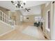 Bright living room boasts vaulted ceilings, a cozy fireplace, and easy access to the front door at 3565 W 112Th Cir, Westminster, CO 80031