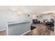 Finished basement featuring a bar, a hardwood floor and a cozy seating area for entertaining at 120 Field St, Lakewood, CO 80226