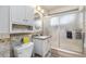 Bathroom featuring a vanity with a gray countertop and a glass-enclosed shower at 120 Field St, Lakewood, CO 80226