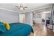 Bright and spacious bedroom with hardwood flooring, featuring a connecting space at 120 Field St, Lakewood, CO 80226