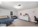 Finished basement bedroom with carpet flooring, plush seating and a bed at 120 Field St, Lakewood, CO 80226