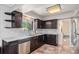 Beautiful kitchen featuring granite countertops, stainless steel appliances, and dark wood cabinetry at 120 Field St, Lakewood, CO 80226