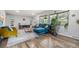 Inviting living room featuring stylish decor, hardwood floors, and large windows offering ample natural light at 120 Field St, Lakewood, CO 80226