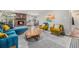Bright living room with stylish furniture, brick fireplace, and an inviting open layout at 120 Field St, Lakewood, CO 80226