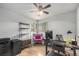 Well-lit home office with hardwood flooring, a ceiling fan, and a functional desk setup at 120 Field St, Lakewood, CO 80226