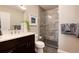 Stylish bathroom with a sleek vanity, modern glass shower, and elegant fixtures and fresh towels at 675 S Clinton St # 8B, Denver, CO 80247