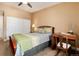 Relaxing bedroom boasts a bed, desk, and serene ambiance for restful nights and productive days at 675 S Clinton St # 8B, Denver, CO 80247