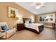 A cozy bedroom features a comfortable bed, stylish furnishings, and an art piece at 675 S Clinton St # 8B, Denver, CO 80247