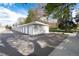 A row of white detached garages offer ample parking and storage in the community at 675 S Clinton St # 8B, Denver, CO 80247