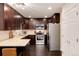 Updated kitchen featuring granite countertops, stainless steel appliances, and ample cabinet space at 675 S Clinton St # 8B, Denver, CO 80247