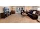 Spacious living room featuring comfortable furniture, carpeting, and sliding glass doors at 675 S Clinton St # 8B, Denver, CO 80247
