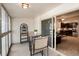 Enclosed sunroom with sliding door access and seating area, perfect for relaxing at 675 S Clinton St # 8B, Denver, CO 80247
