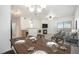 Open-concept dining area with modern furnishings and a view of the cozy living space at 10149 W 55Th Dr # 3, Arvada, CO 80002