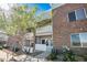 Two-story condo with brick exterior and small private patio at 10149 W 55Th Dr # 3, Arvada, CO 80002