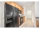 Functional kitchen featuring black appliances, tile flooring, and ample cabinet space at 10149 W 55Th Dr # 3, Arvada, CO 80002