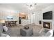 Inviting living room with fireplace, plush seating, and view into the dining area and kitchen at 10149 W 55Th Dr # 3, Arvada, CO 80002