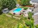 Aerial view of a backyard featuring a pristine pool, gazebo, and lush landscaped areas at 4245 S Dawson St, Aurora, CO 80014