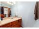 Bathroom with a double sink vanity and a door to the shower at 4245 S Dawson St, Aurora, CO 80014