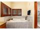 Luxurious bathtub with tiled surround and wood shuttered windows at 4245 S Dawson St, Aurora, CO 80014