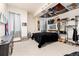 Eclectic bedroom with a black bed, storage, and posters on the ceiling at 4245 S Dawson St, Aurora, CO 80014
