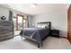Cozy bedroom with natural light and a stylish bed frame at 4245 S Dawson St, Aurora, CO 80014