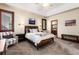 Inviting bedroom featuring a queen bed, neutral walls, and warm shuttered windows at 4245 S Dawson St, Aurora, CO 80014
