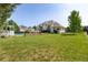 Expansive backyard featuring manicured lawn, pool, and gazebo creating an ideal outdoor oasis at 4245 S Dawson St, Aurora, CO 80014