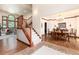 Open foyer with a staircase, tile flooring, hardwood floors, and views into the dining and living rooms at 4245 S Dawson St, Aurora, CO 80014