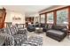 Spacious living room with a large sectional couch, area rug, and plenty of natural light at 4245 S Dawson St, Aurora, CO 80014