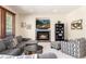 Comfortable living room featuring a fireplace, built-in shelving, and a large sectional sofa at 4245 S Dawson St, Aurora, CO 80014